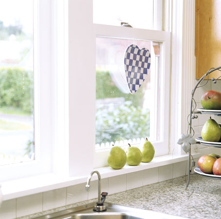To provide energy-efficient design, the couple used tilt-pack double-pane windows, custom-fit into the original wood window casings.